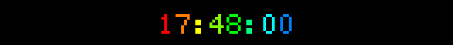 clock with format = "%H:%M:%S" and font_color = "rainbow" — the seconds advance because the time is recomputed each draw